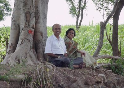 Dr. Vasant Lad and Usha under their Banyan Tree at farm