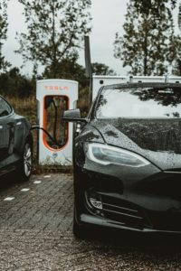 Tesla Auto at Charging stations by andreas-dress-Unsplash