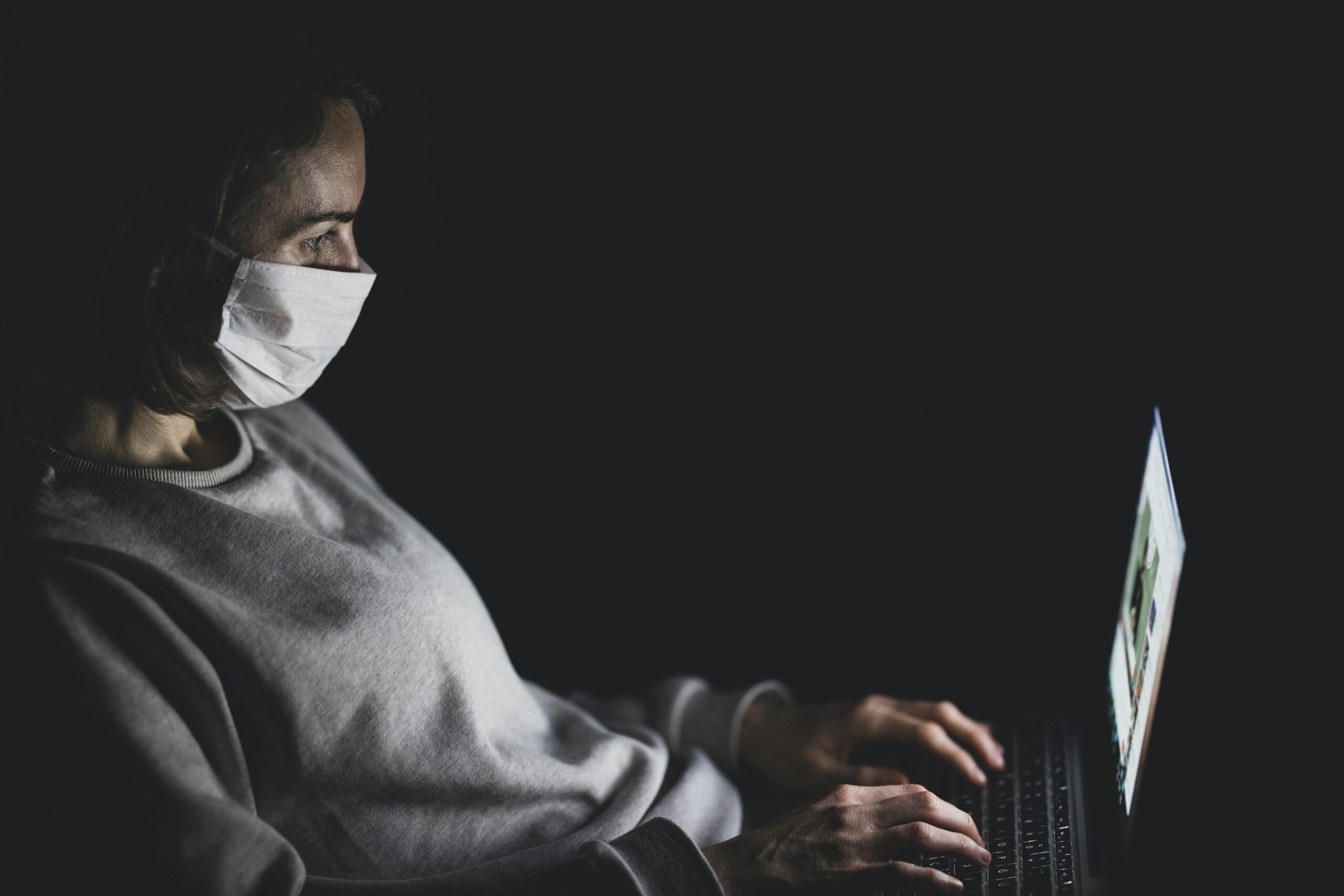 engin-akyurt-Student with mask studying on laptop-unsplash