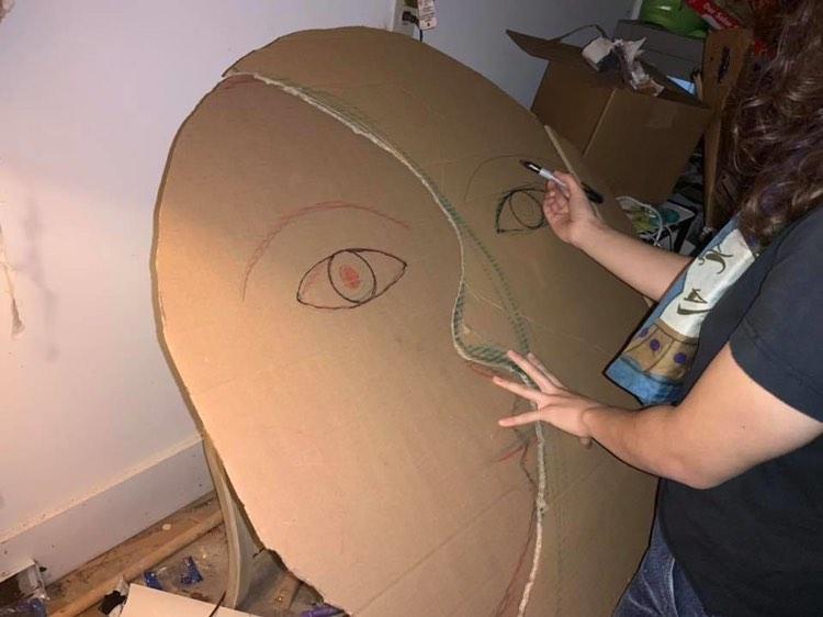 Image of Sophie Joy sketching the outlines for light up moon puppet commisioned by Hillsborough Arts council for 2019 Hillsborough Lantern walk