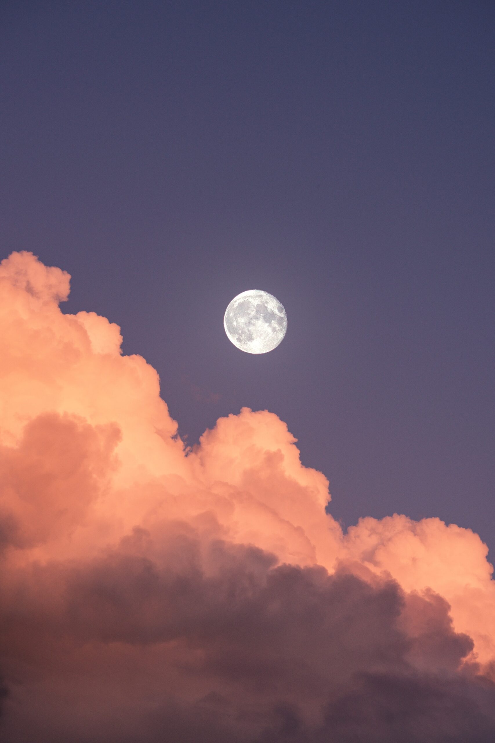 Moon above the clouds by Ingmar from Unsplash