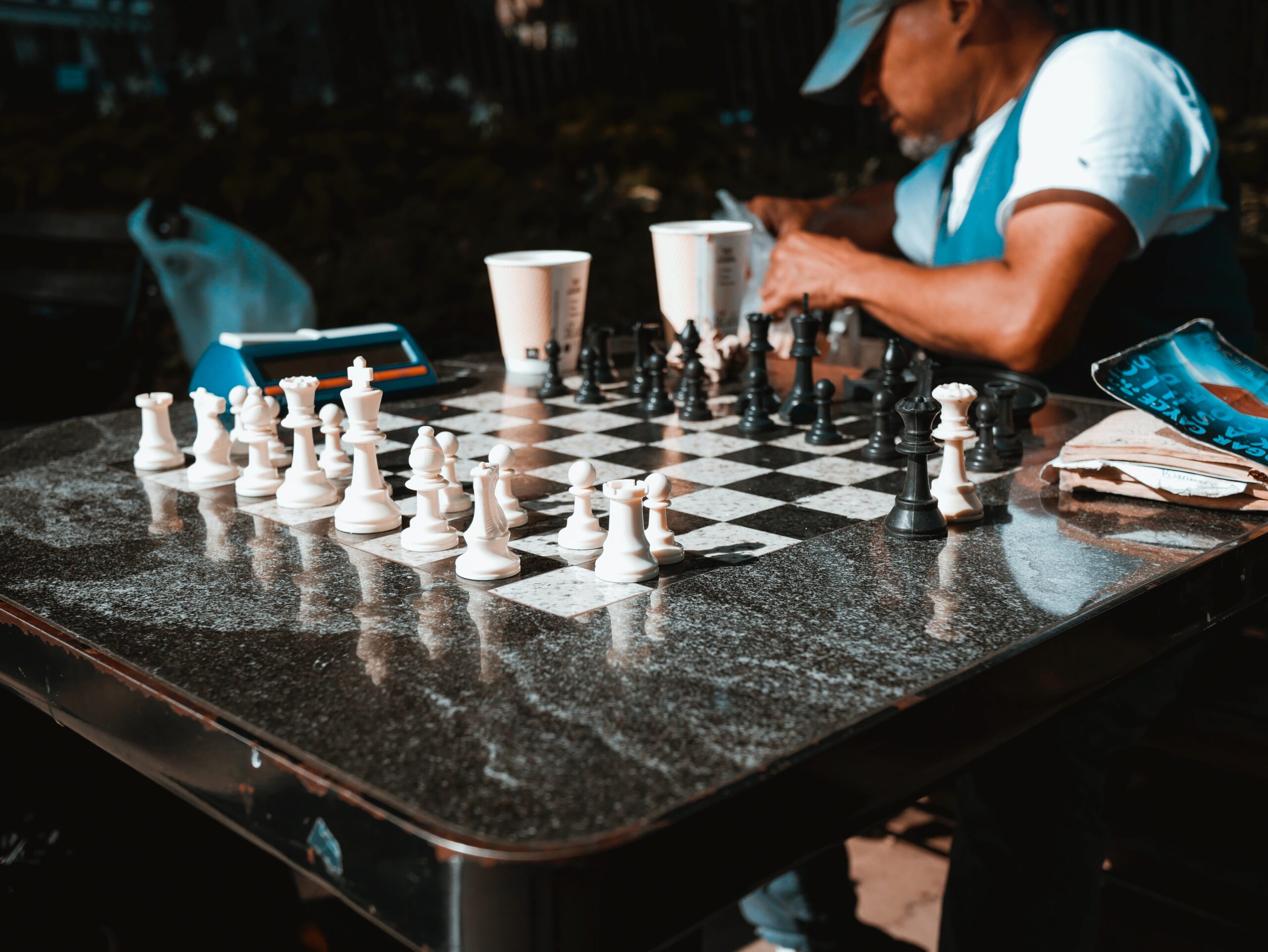 josh-appel-Man at marble chess table set and ready for match partner-unsplash