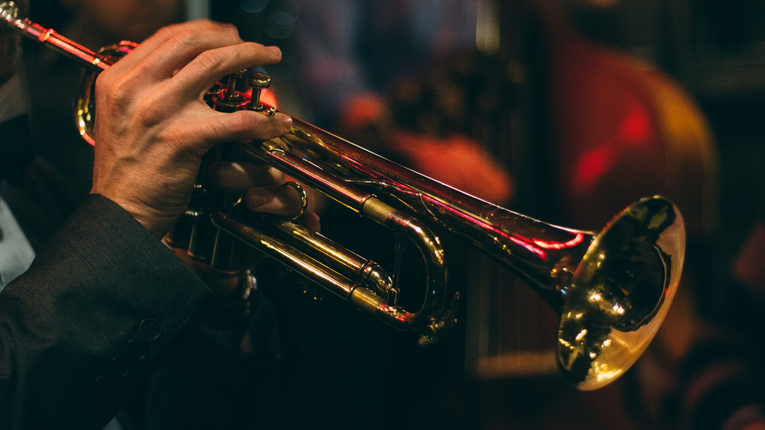 Trumpeter holding horn by Chris Bair from Unsplash