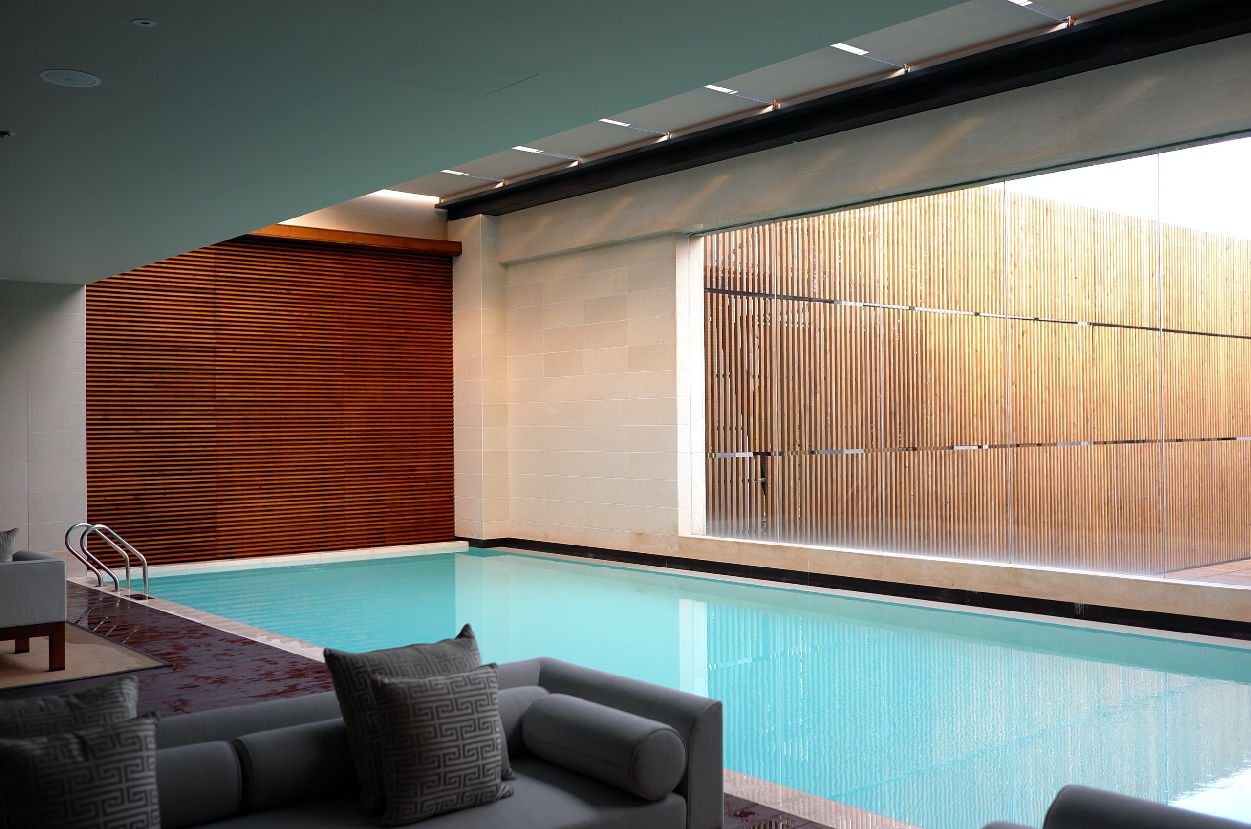 li-yang-Indoor pool contemporary home with bamboo blinds-unsplash