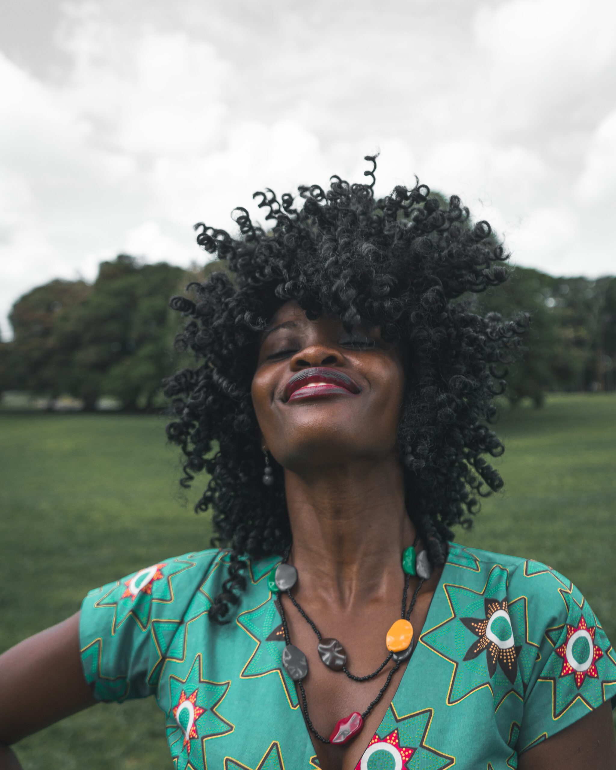miguel-bruna-woman with head tilted back in joy-unsplash miguel-bruna-woman with head tilted back in joy-