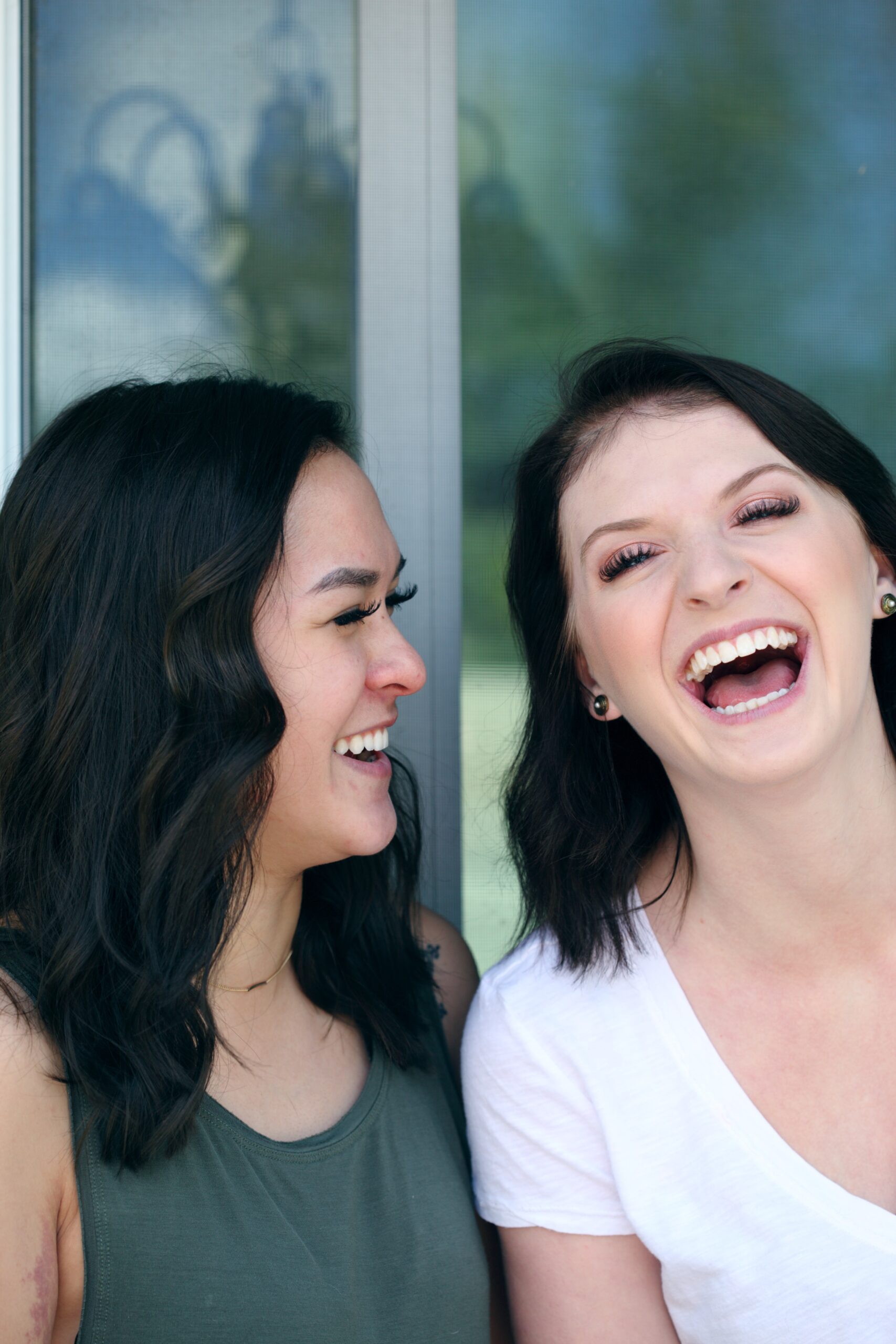 sharon-mccutcheon-female couple laughing together-unsplash