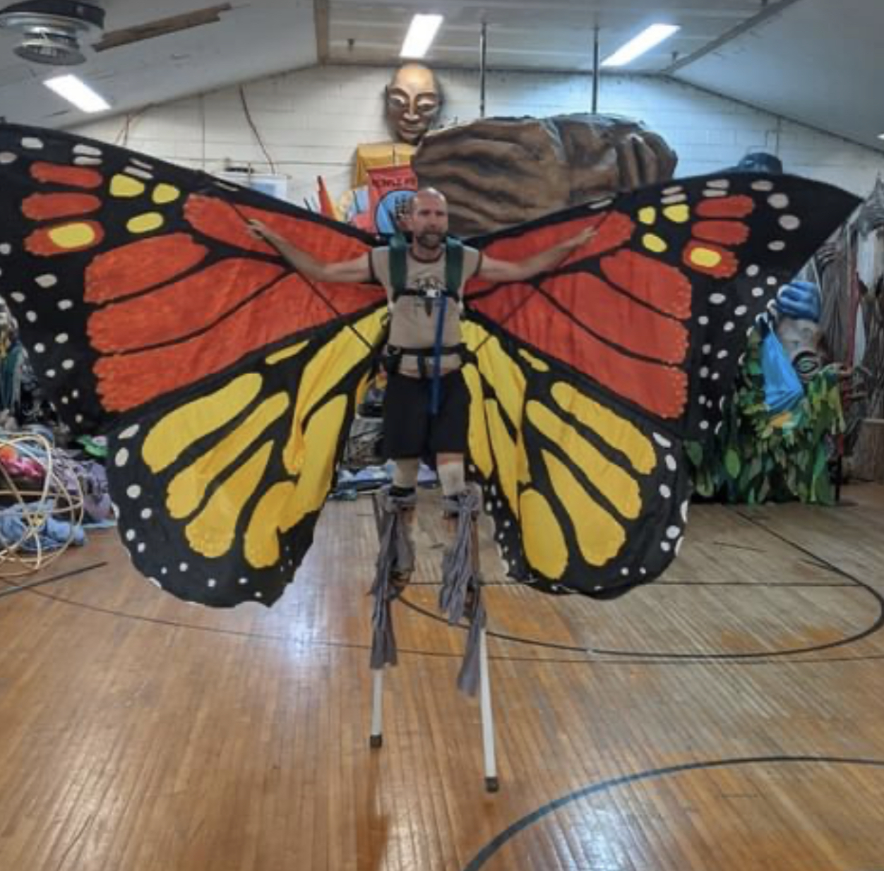 Sol Ramirez with Covid Mask holding skeleton Head mask in workshop by Aeon Schmoock