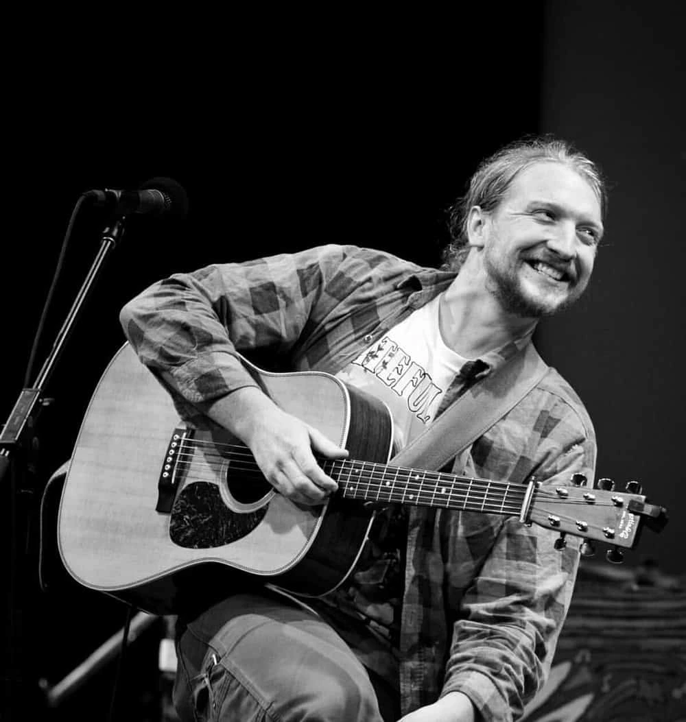 Tyler Childers with guitar header image for Durham Cool