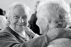 artyom-kabajev-senior friends dancing together in joy-unsplash-scaled
