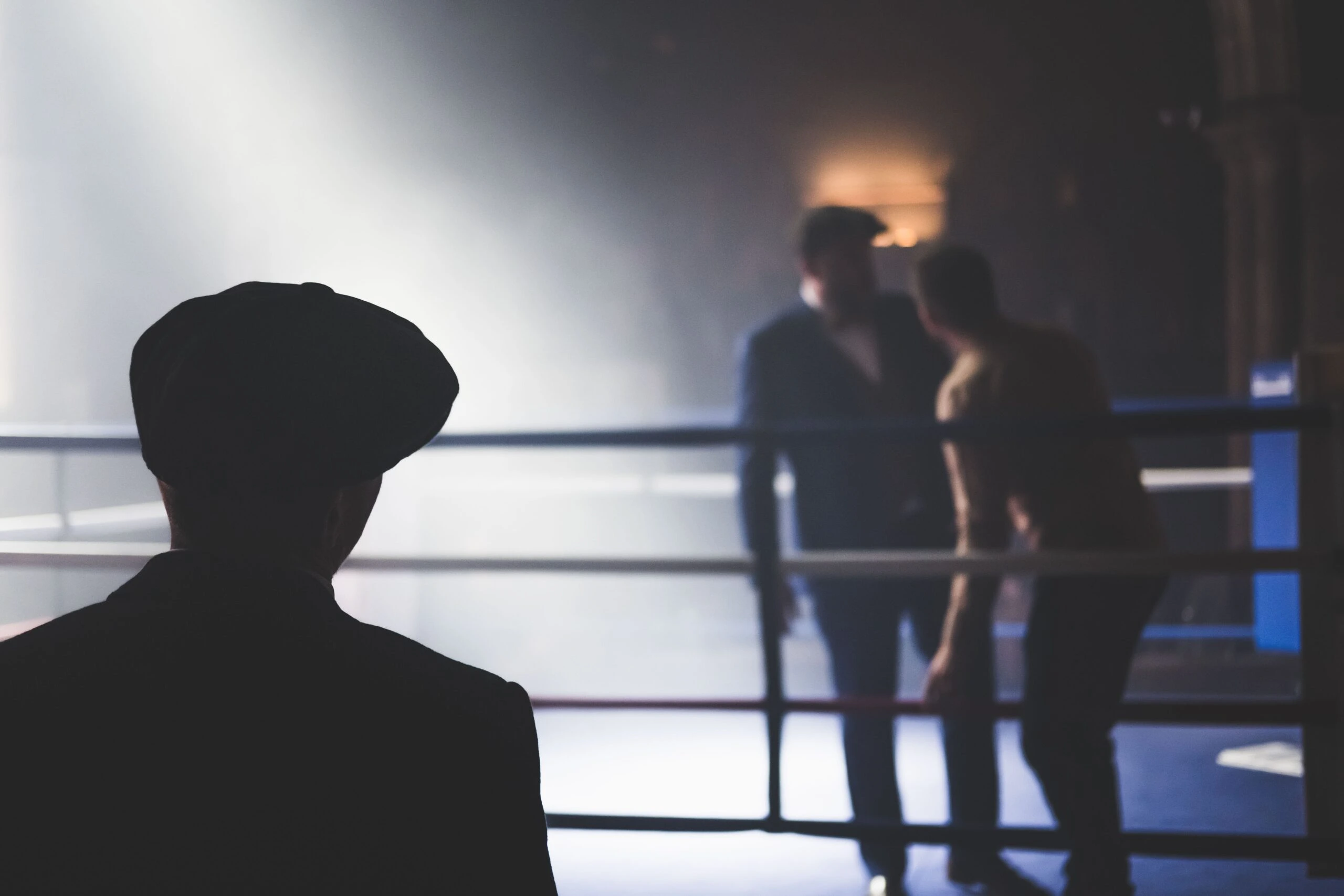 dan-burton-A scene in a boxing ring two men film noir Dan Burton image from Unsplash
