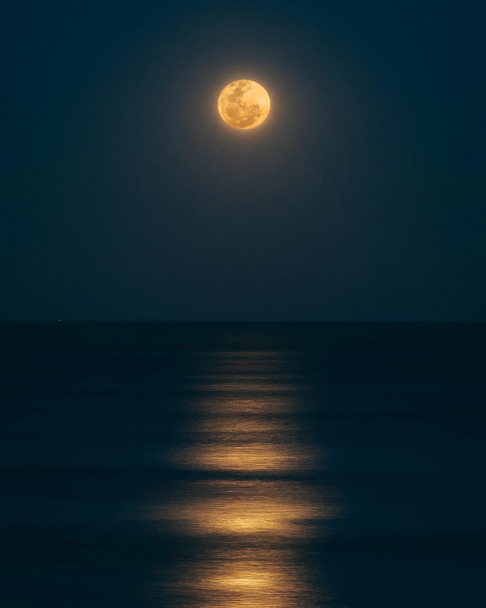 guzman-barquin-full moonlight over ocean-unsplash