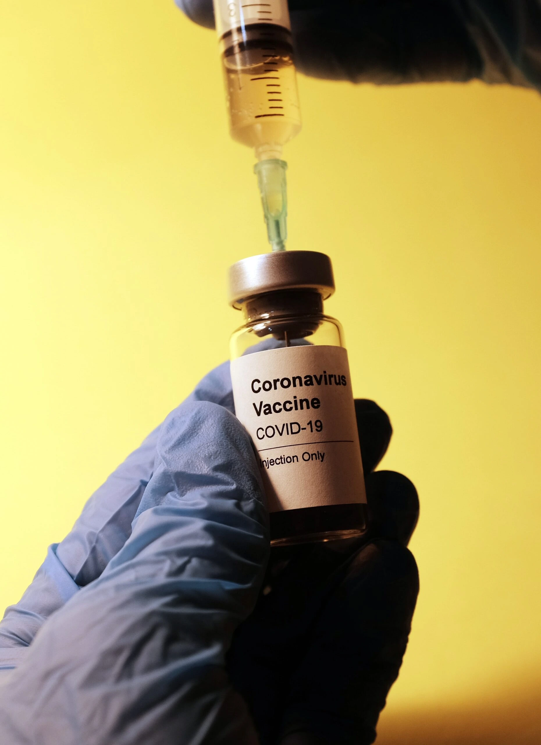 hakan-nural-Syringe drawing COVID19 vaccine dose-unsplash-scaled