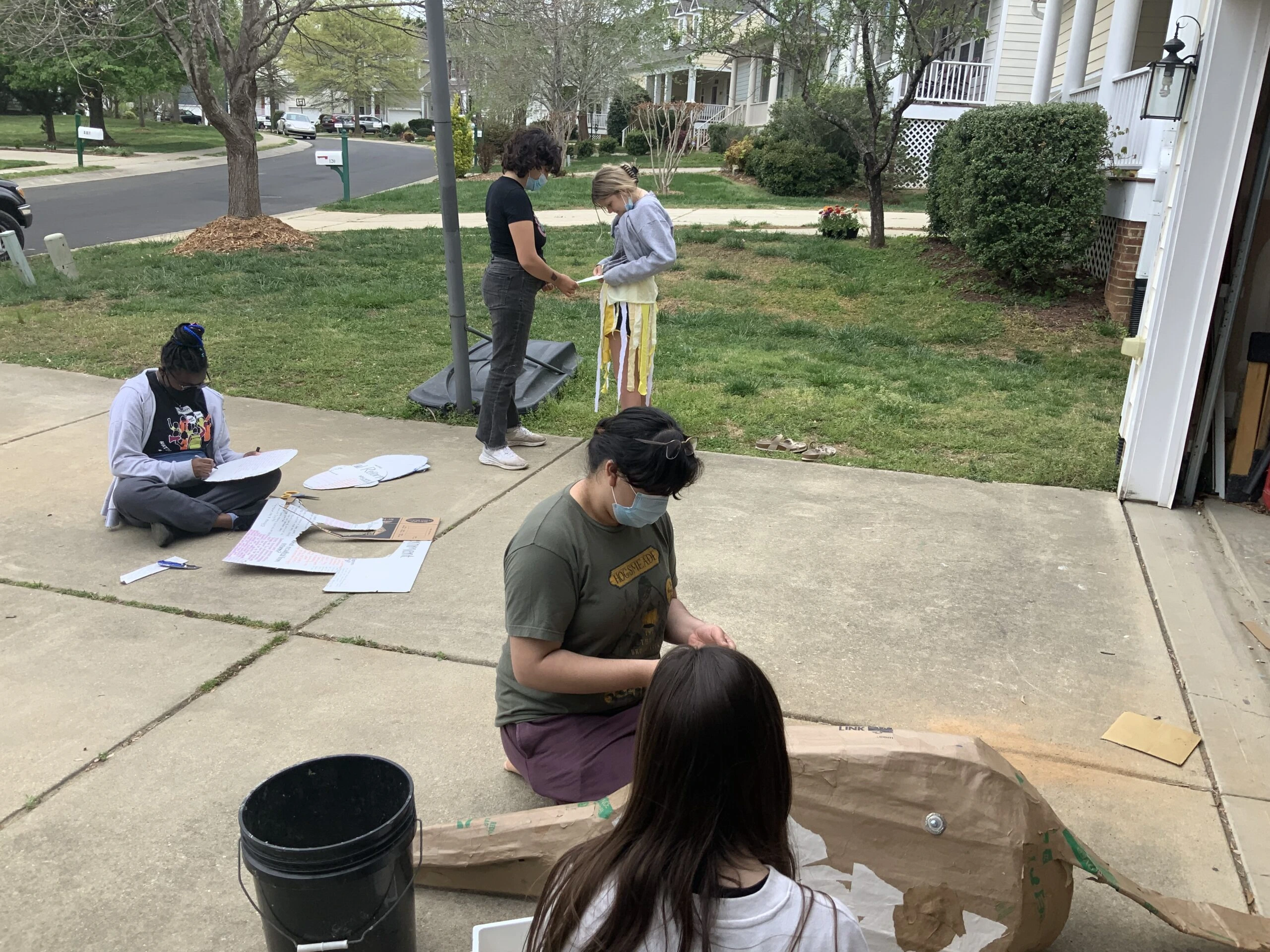 Zola, Maeve, Kennedy, Erin, and Melanie working on sets and masks for the Time We Have play
