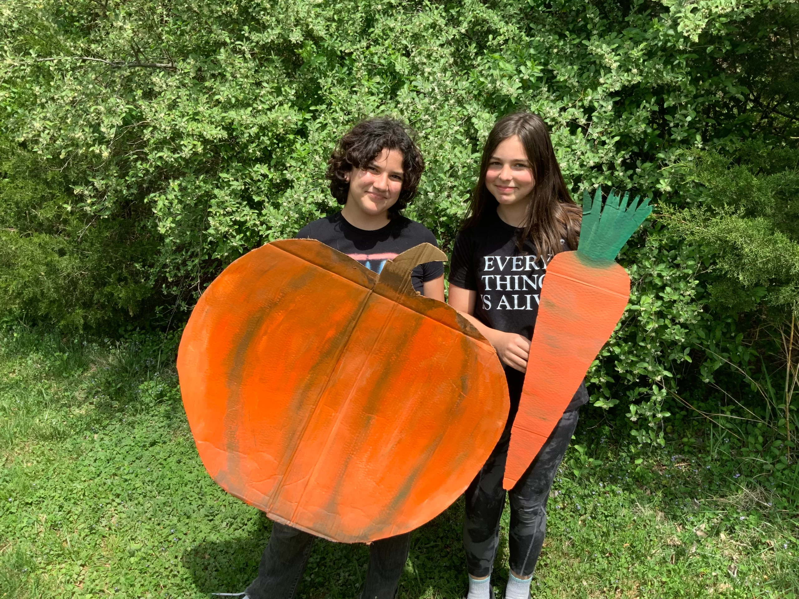 Zola Ramirez and Katie holding masks for The Time we have 1,2,3 Puppetry play