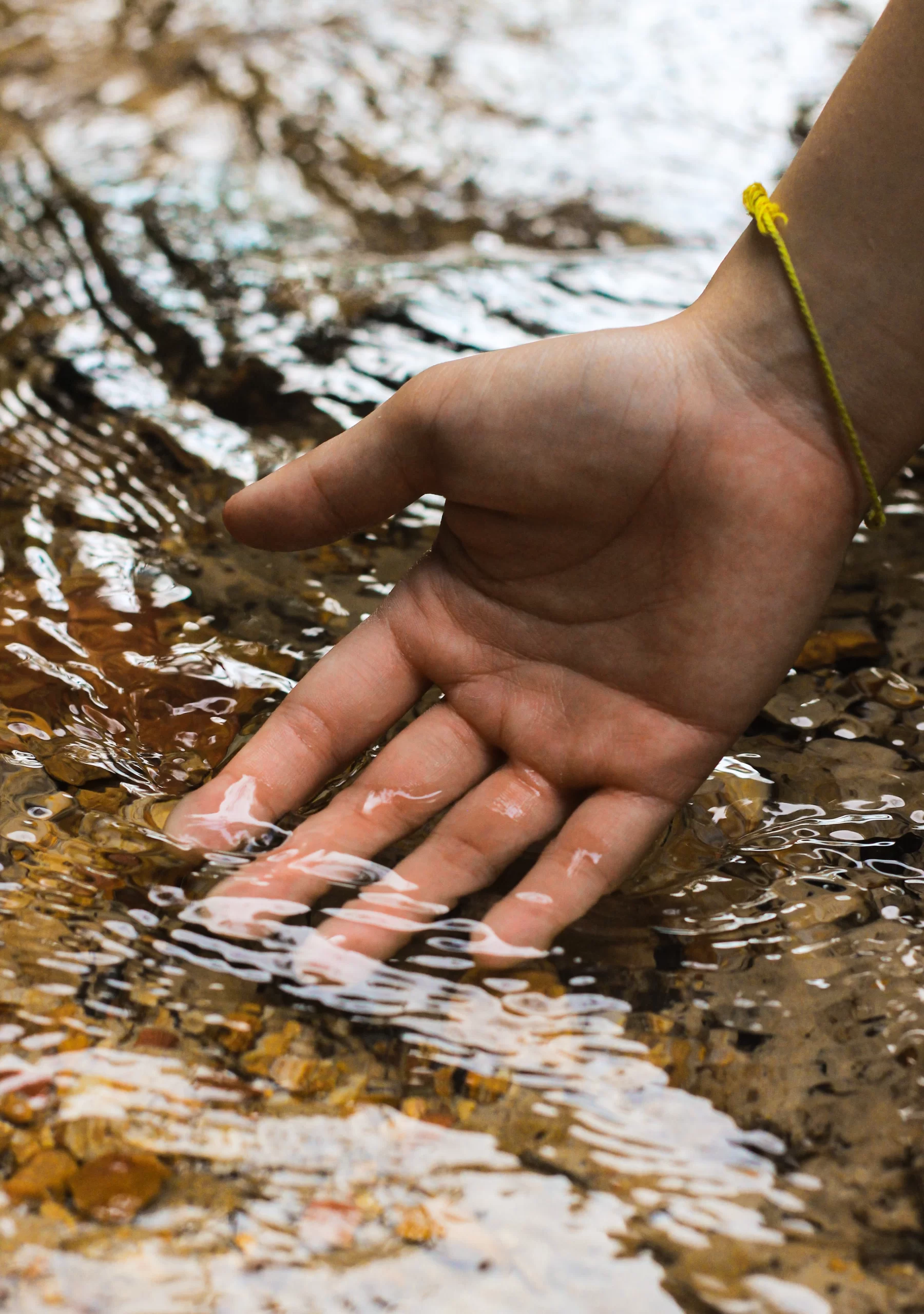 nicholas-ng-hand up close in stream-unsplash nicholas-ng-hand up close in stream-unsplash