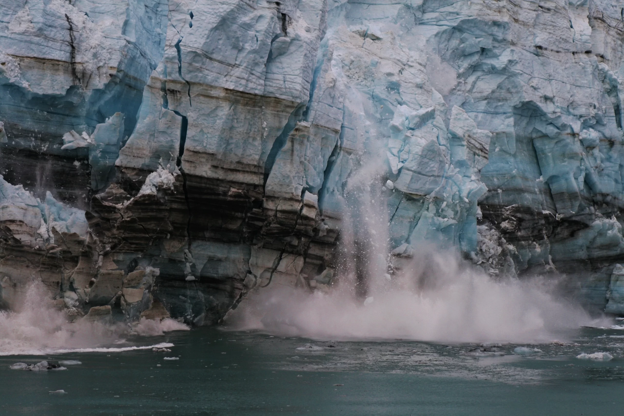 noaa-Canon-EOS-DIGITAL-REBEL-XTi-Dual-License-Public-Domain-Unsplash-License-A-calving-glacier.-Witness-to-global-warming.-unsplash-scaled.webp