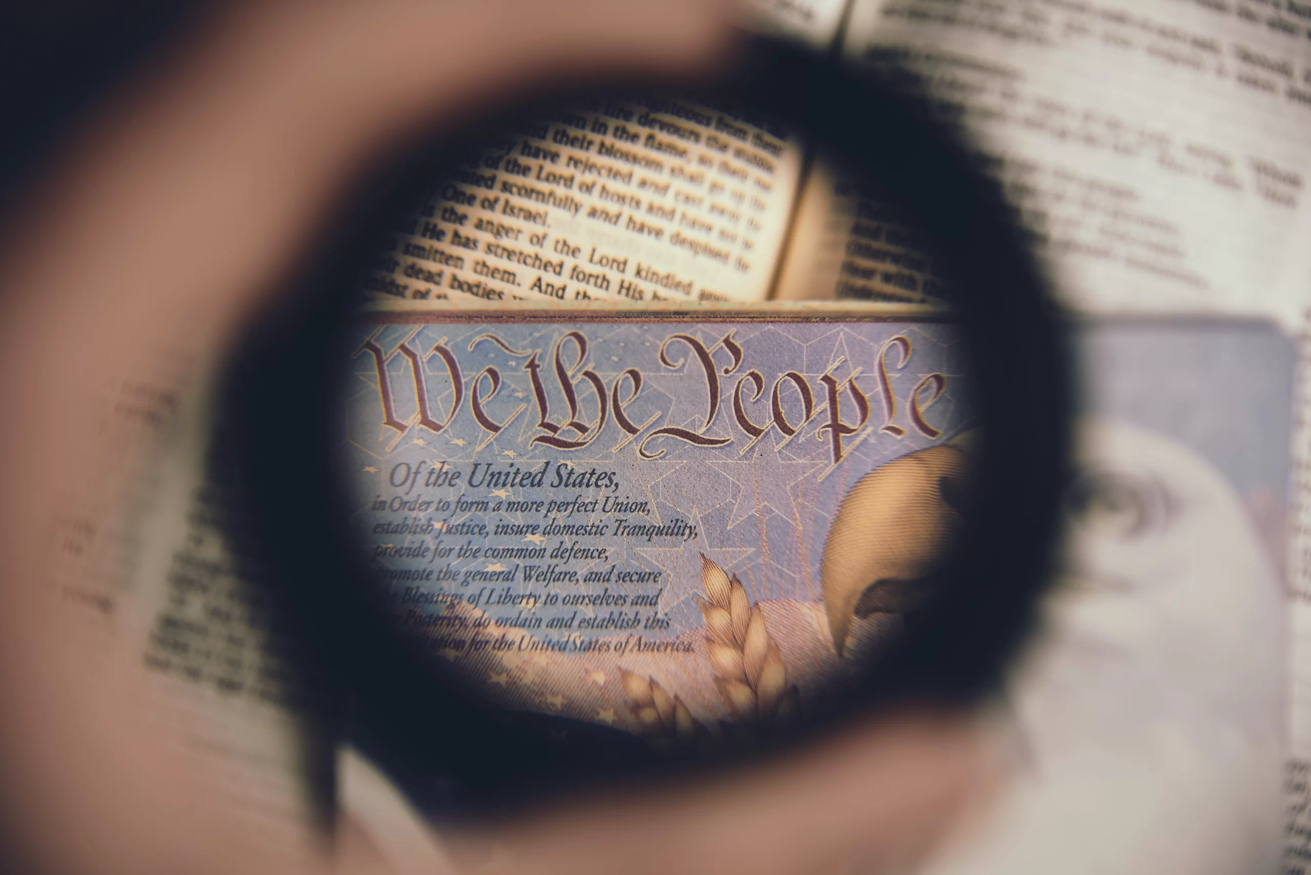 anthony-garand-We the People magnified lens held over US constitution -unsplash
