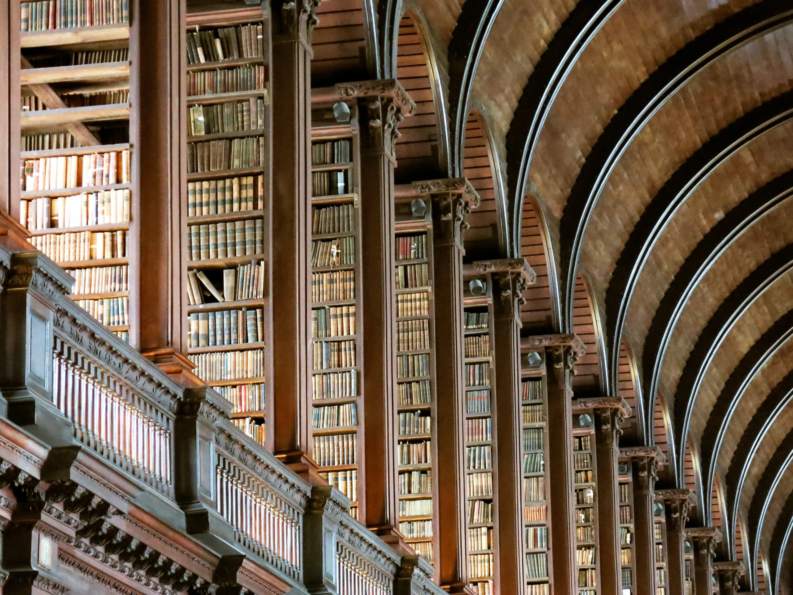 jonathan-singer-The Long Room of the Old LIbrary at Trinity College unsplash Featured in Editorial, Arts & Culture The Long Room Of The Old Library At Trinity College, Dublin, Ireland Published on July 3, 2018 Canon, PowerShot G15 Free to use under the Unsplash License The Long Room at Trinity College is one of the most beautiful libraries in the world. I took dozens of photos, but this one captured everything I love about the library: you see the old books (larger on the bottom and smaller on top), the beautiful columns standing guard in front of the shelves, and the graceful soaring of the rounded ceiling. I’m proud of this photo because they don’t allow tripods or flashes - this is the natural beauty of the room. My only wish is that we had smell-o-vision, because the smell of old books that permeates the Long Room is intoxicating.