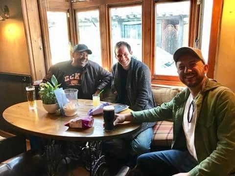 Brother Strut around the table with pints checking in