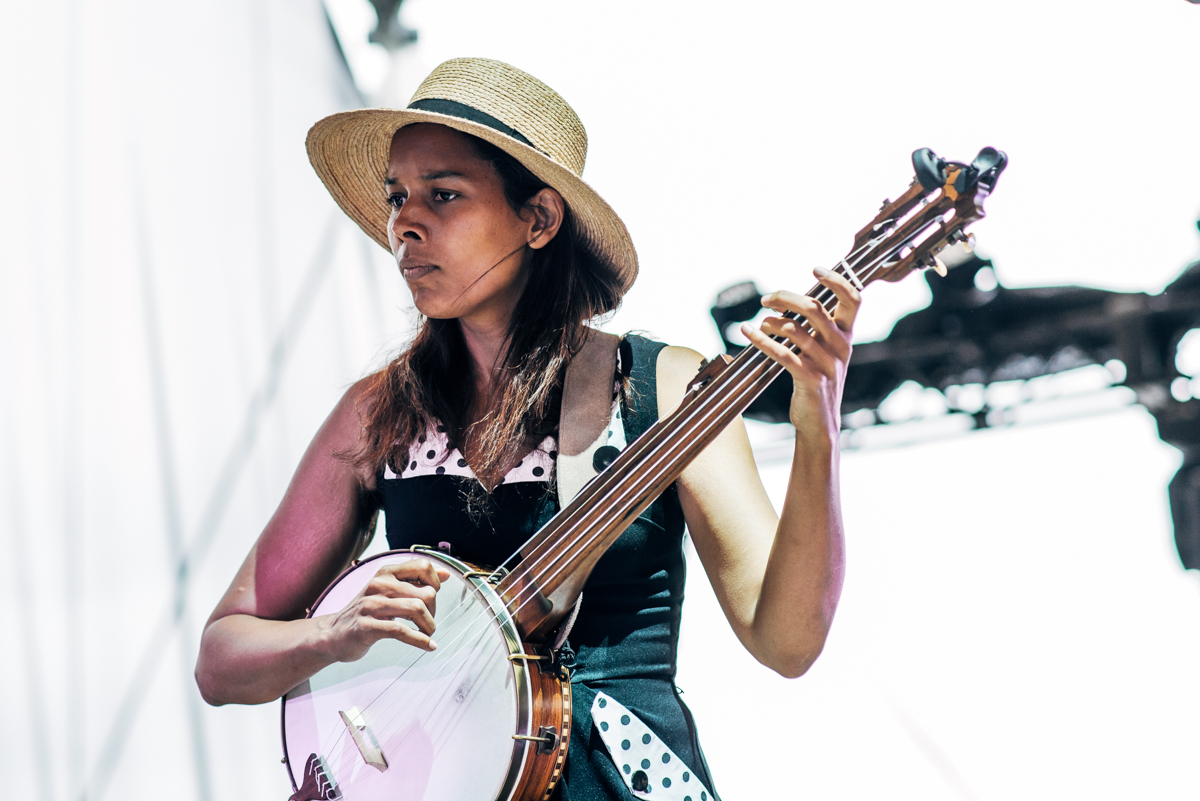 Image by Levi Manchak Rhiannon Giddens by Levi Manchak Interstellar Rodeo, Edmonton, Canada. w:en:Creative Commons attribution This file is licensed under the Creative Commons Attribution 2.0 Generic license. You are free: to share – to copy, distribute and transmit the work to remix – to adapt the work Under the following conditions: attribution – You must give appropriate credit, provide a link to the license, and indicate if changes were made. You may do so in any reasonable manner, but not in any way that suggests the licensor endorses you or your use.