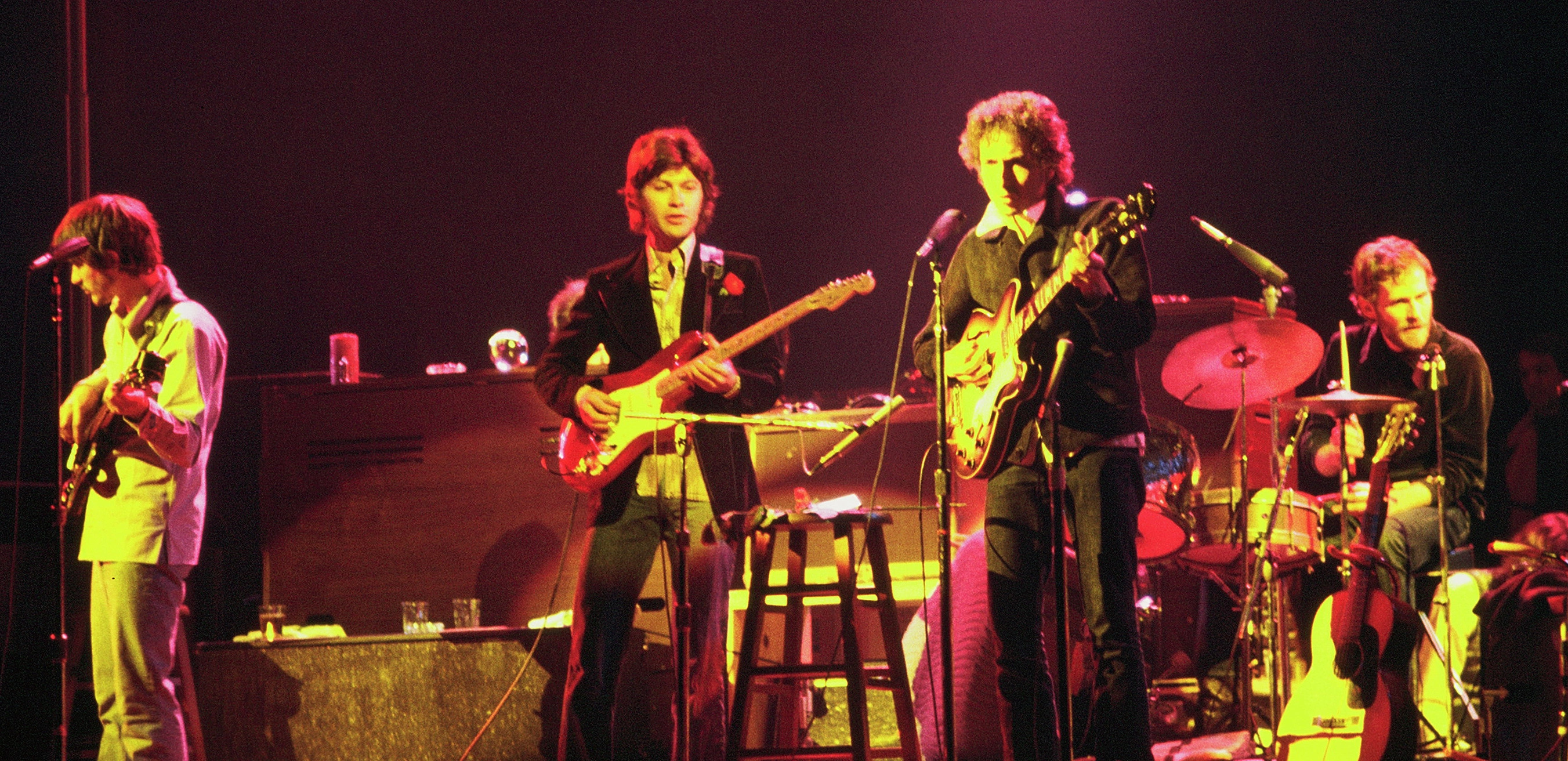 Bob_Dylan_and_The_Band_-_1974 Bob Dylan and The Band touring in Chicago, 1974 (Left to right: Rick Danko (bass), Robbie Robertson (guitar), Bob Dylan (guitar), Levon Helm(drums) Date 1974 Source Wikipedia:Contact us/Photo submission Author Jim Summaria. This work is free and may be used by anyone for any purpose. If you wish to use this content, you do not need to request permission as long as you follow any licensing requirements mentioned on this page. The Wikimedia Foundation has received an e-mail confirming that the copyright holder has approved publication under the terms mentioned on this page. This correspondence has been reviewed by a Volunteer Response Team (VRT) member and stored in our permission archive. The correspondence is available to trusted volunteers as ticket #2008122410016741.