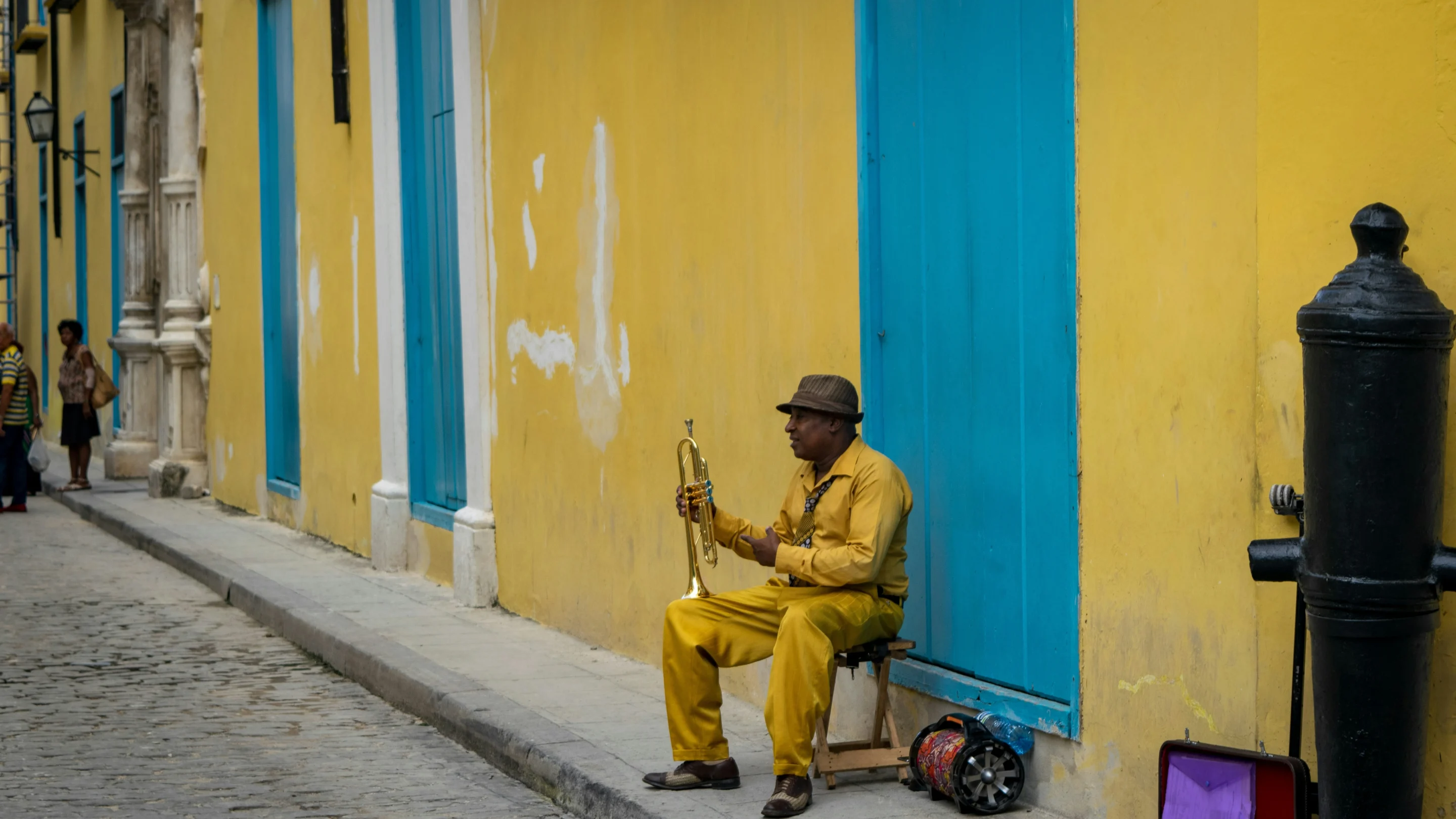 ben-turnbull-Havana, Cuba Published on July 19, 2019 NIKON CORPORATION, NIKON D3300 Free to use under the Unsplash License ben-turnbull- Trumpet player sitting on sidewalk, waitng to play=Havana, Cuba Published on July 19, 2019 NIKON CORPORATION, NIKON D3300 Free to use under the Unsplash License
